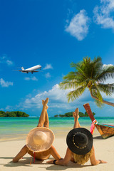 Cute women relaxing on the summer beach.
