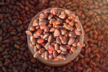 Cedar nuts in glass jar, top view