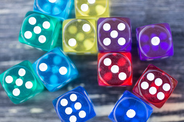 colorful dice isolated on wooden table