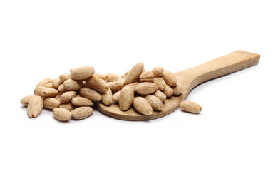 Blanched almonds with wooden spoon isolated on white background