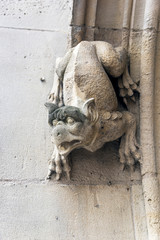 Fototapeta na wymiar Gargoyles on the wall of a medieval building.