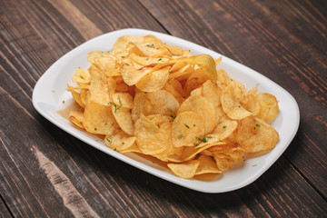 White plate with chips as beer snack