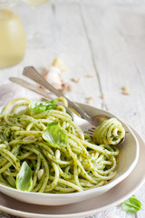 Spaghetti pasta with pesto sauce