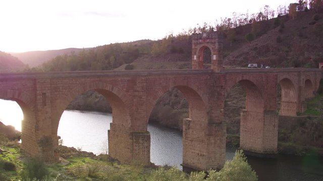 Cinematic tracking shot of Alc&radic;&deg;ntara Bridge