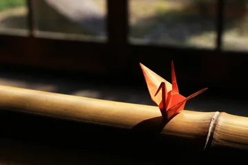 Fotobehang Kraanvogels Origami crane which is placed on the window side of Japanese style houses  © Kazuhiro.Suzuki