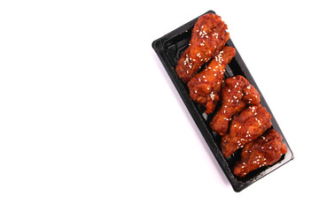Korean fried chicken with white backdrop.