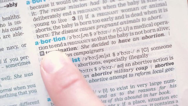 searching for and finding a word abortion definition in a dictionary