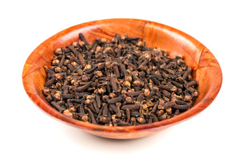 Whole clove heads and pieces isolated over white