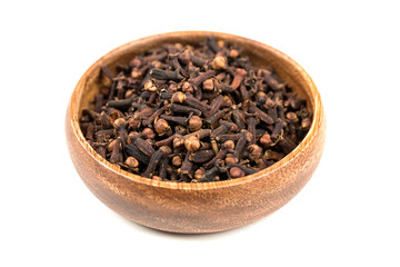 Whole clove heads and pieces isolated over white