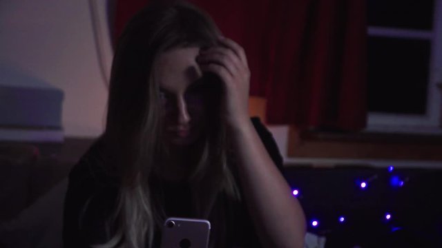 Pretty girl trying to find the right pose angle to make a perfect selfie to post on her instagram.