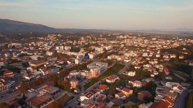 High altitude aerial shot rising up over the city of Ulcinj, Montenegro