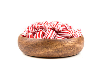Red and white striped holiday candy isolated over white