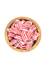 Red and white striped holiday candy isolated over white