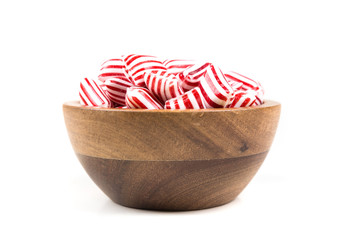 Red and white striped holiday candy isolated over white