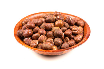 Pile of whole unshelled hazelnuts isolated
