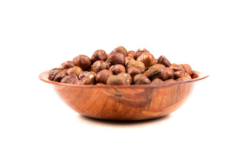 Pile of whole unshelled hazelnuts isolated