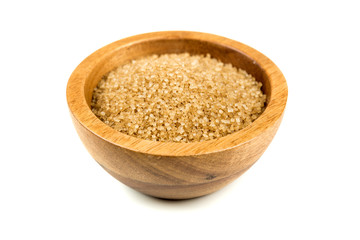 Scoop of raw cane sugar isolated over white