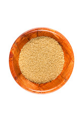 Scoop of raw cane sugar isolated over white
