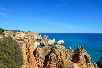 Fototapeta na wymiar Elevated view of the cliffs with views across the ocean, Praia da Rocha, Portimao, Portugal.