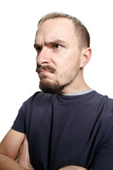 Obraz premium Sertious business man standing isolated on white studio background. Beautiful male half-length portrait. Young emotional man. The human emotions, facial expression concept. Profile