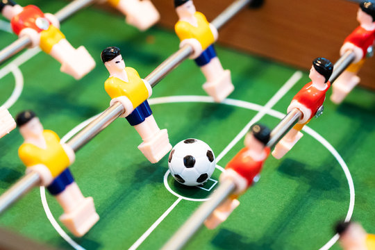 Foosball table soccer. football player, sport concept