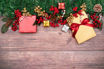 Fototapeta na wymiar Christmas season background and Happy new year gift box and red cherry on wood background