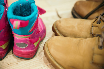 father, mother and daughter shoes. close up view