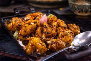 Asian Food fried squid with spoon