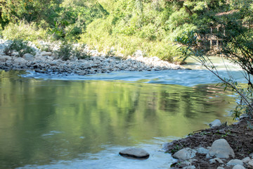 Fototapeta na wymiar The water flow through the rocks in a stream at Wang Nan Pua , Nan in Thailand.