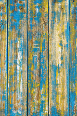 Fototapeta na wymiar old wood dyed in yellow blue white color