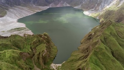 Aerial view of volcanic Lake Pinatubo and mountains, Porac, Philippines.