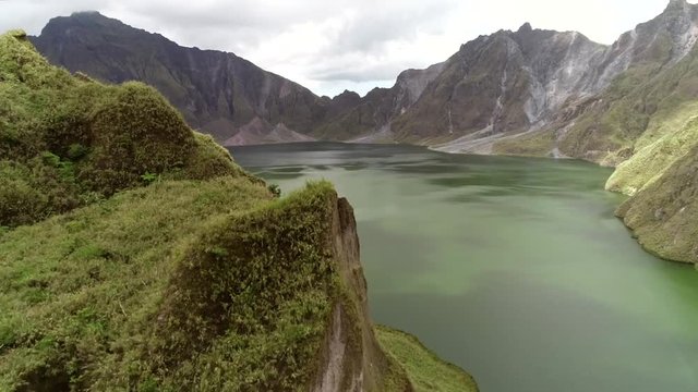 Aerial view of volcanic Lake Pinatubo and mountains, Porac, Philippines.