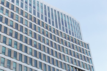 Modern office building against clear blue sky