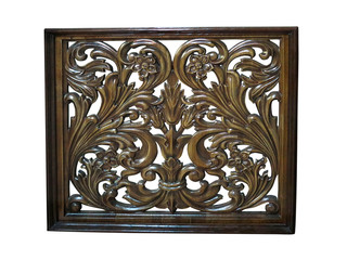 Floral vintage pattern carved in brown wood isolated over white