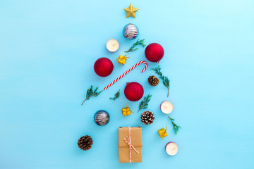 Christmas decoration with gift boxes and ornament on blue background. Creative flat lay , top view
