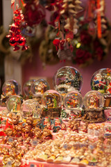 Christmas snow globes souvenirs on the advent market stall, close up
