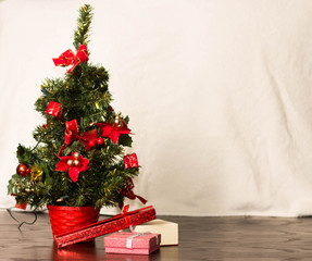 Christmas tree on light background. New Year Card.