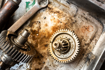 Old shiny motorcycle gears. Disassembly of the engine