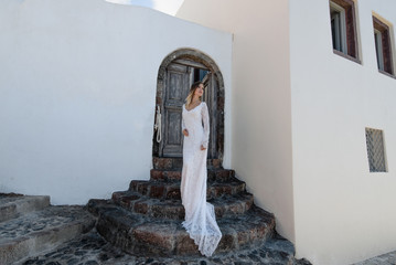 Portrait of a beautiful tender bride woman wearing long luxurious white wedding dress. Beauty, fashion concept.