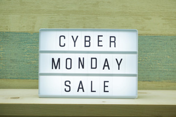 Cyber Monday alphabet letter with light box on wooden background
