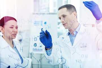 Positive intelligent chemists discussing a chemical formula