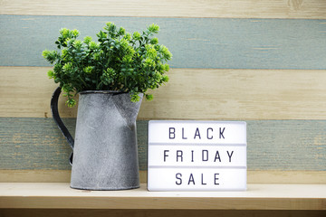 black friday sale shopping concept alphabet on wooden background