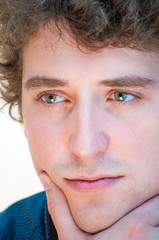 Close-up portrait of green-eyed man