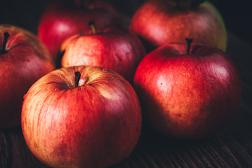 Close-up of red apples on dark background