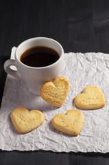 Cookies in the shape of a heart and coffee