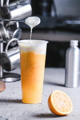 Fresh orange soda covered milk