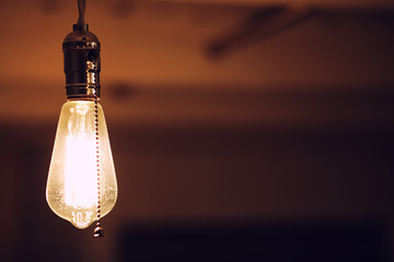 Lamps with tungsten filament. Edison's light bulb. Filament filament in vintage lamps. Retro design...