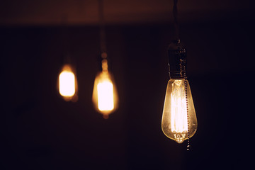 Lamps with tungsten filament. Edison's light bulb. Filament filament in vintage lamps. Retro design...
