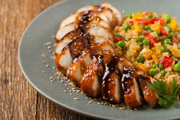 Grilled chicken breast in teriyaki sauce. Served with brown rice and vegetables.