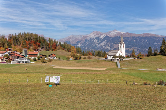 Scenic mountain views of Ringelspitz massif, laundry, church in mountain village Versam, Ruinaulta - Rheinschlucht (Rhine canyon), Illanz/Glion - Reichenau, Switzerland